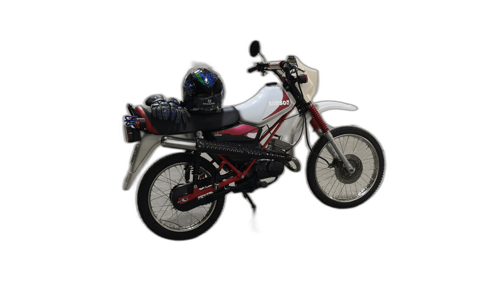 white and red Simson motorcycle with helmet