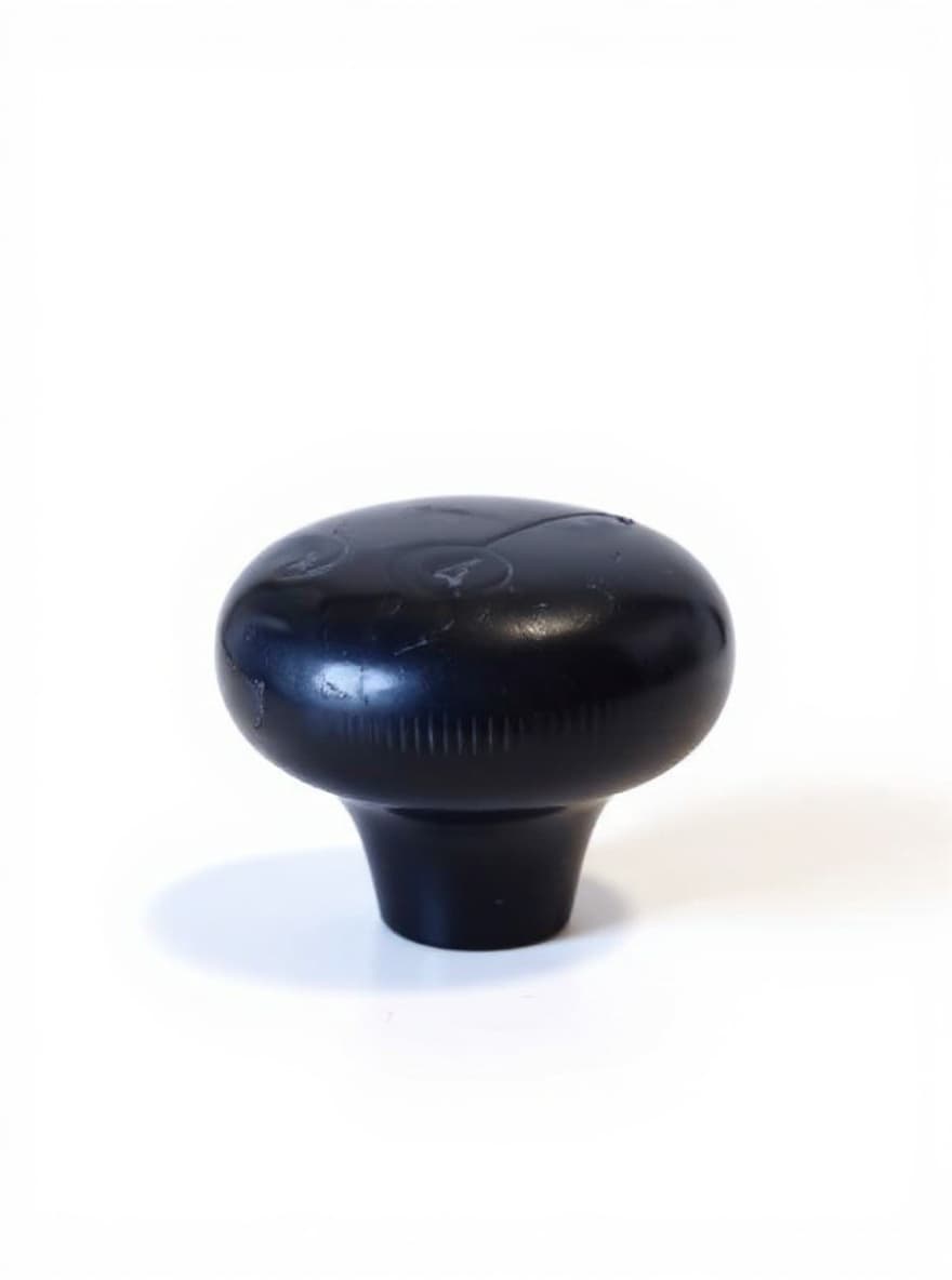 black mushroom-shaped knob