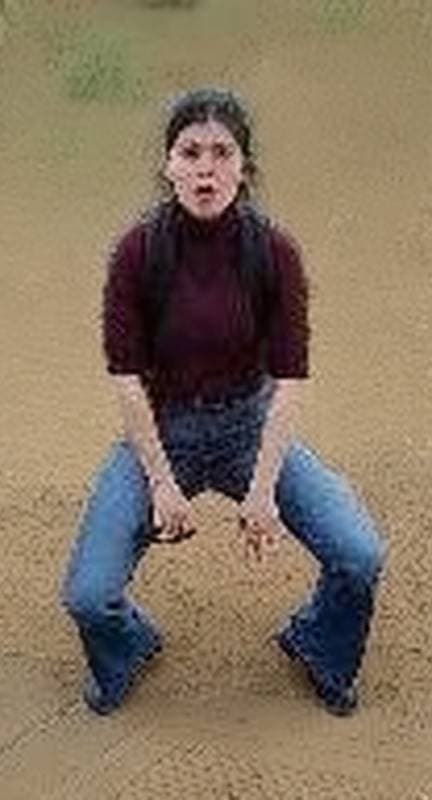 woman crouching on