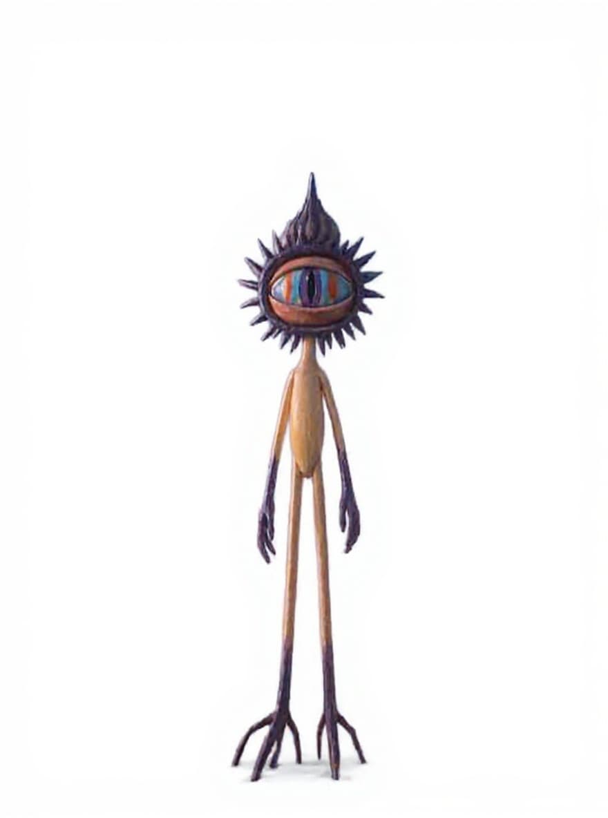wooden alien figure