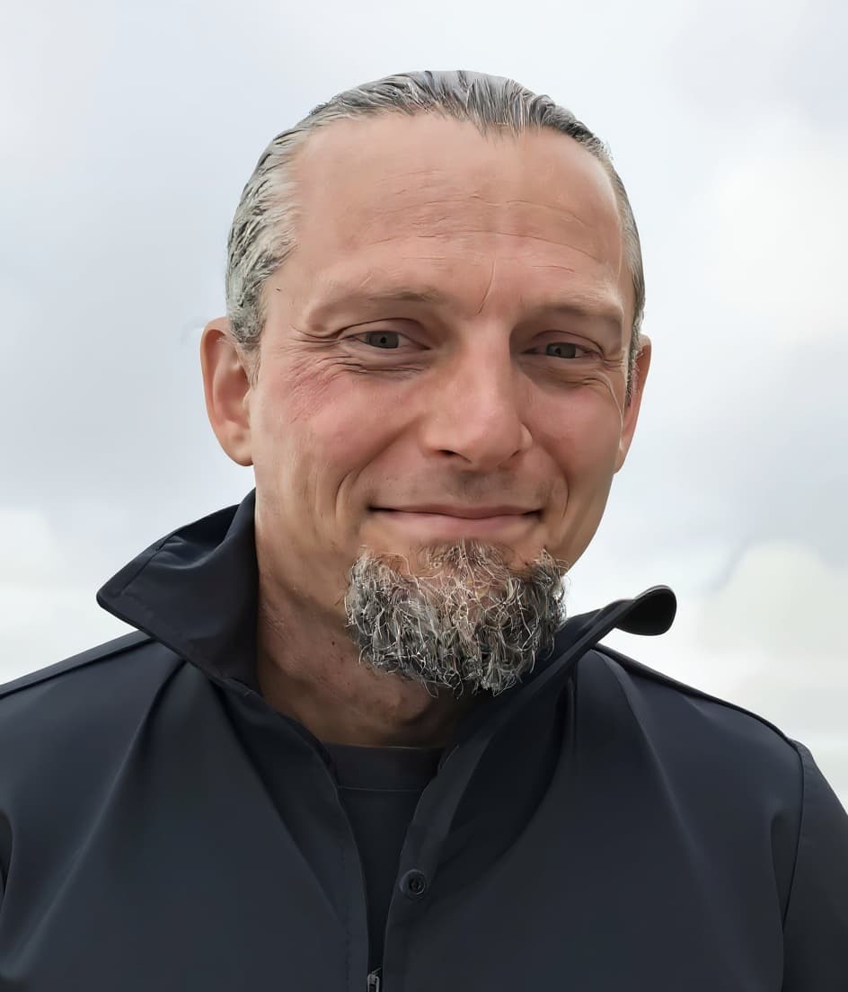 Man with gray hair and goatee