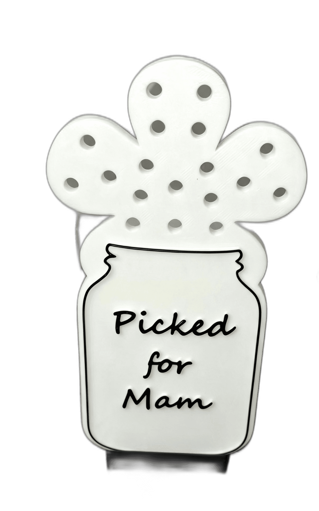 white jar and flower-shaped sign
