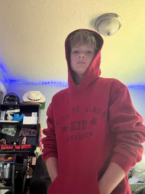 young person in red hooded sweatshirt