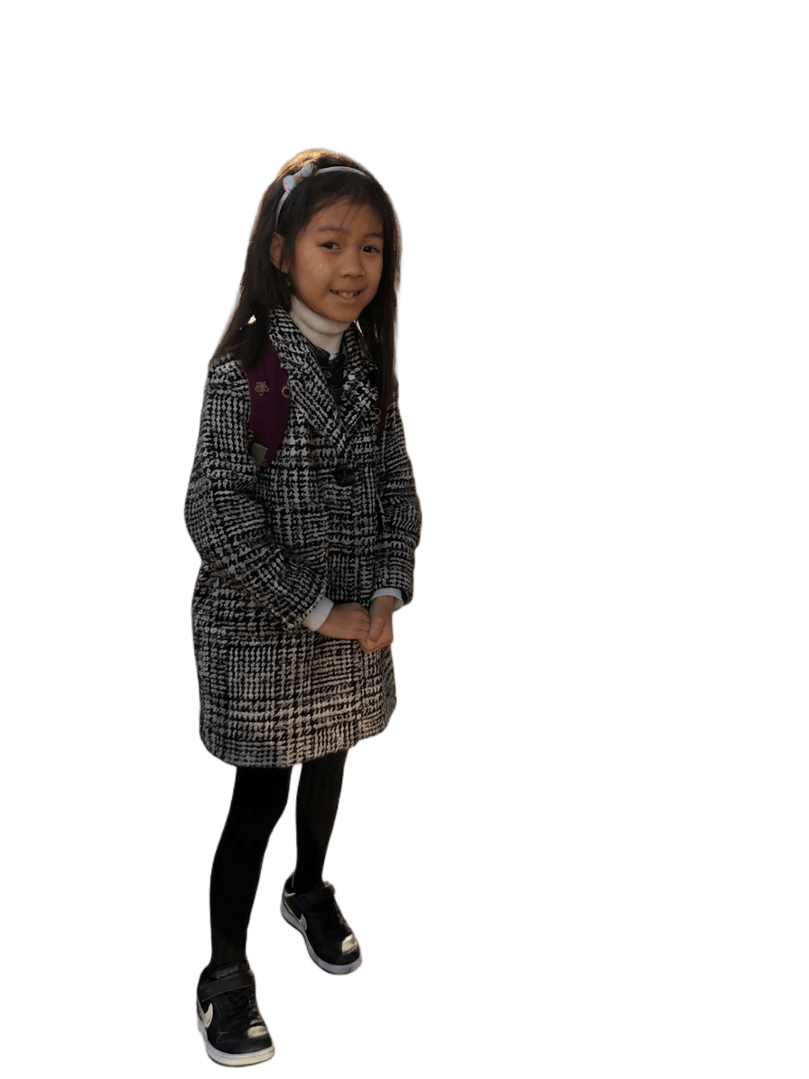 young girl in houndstooth coat and backpack