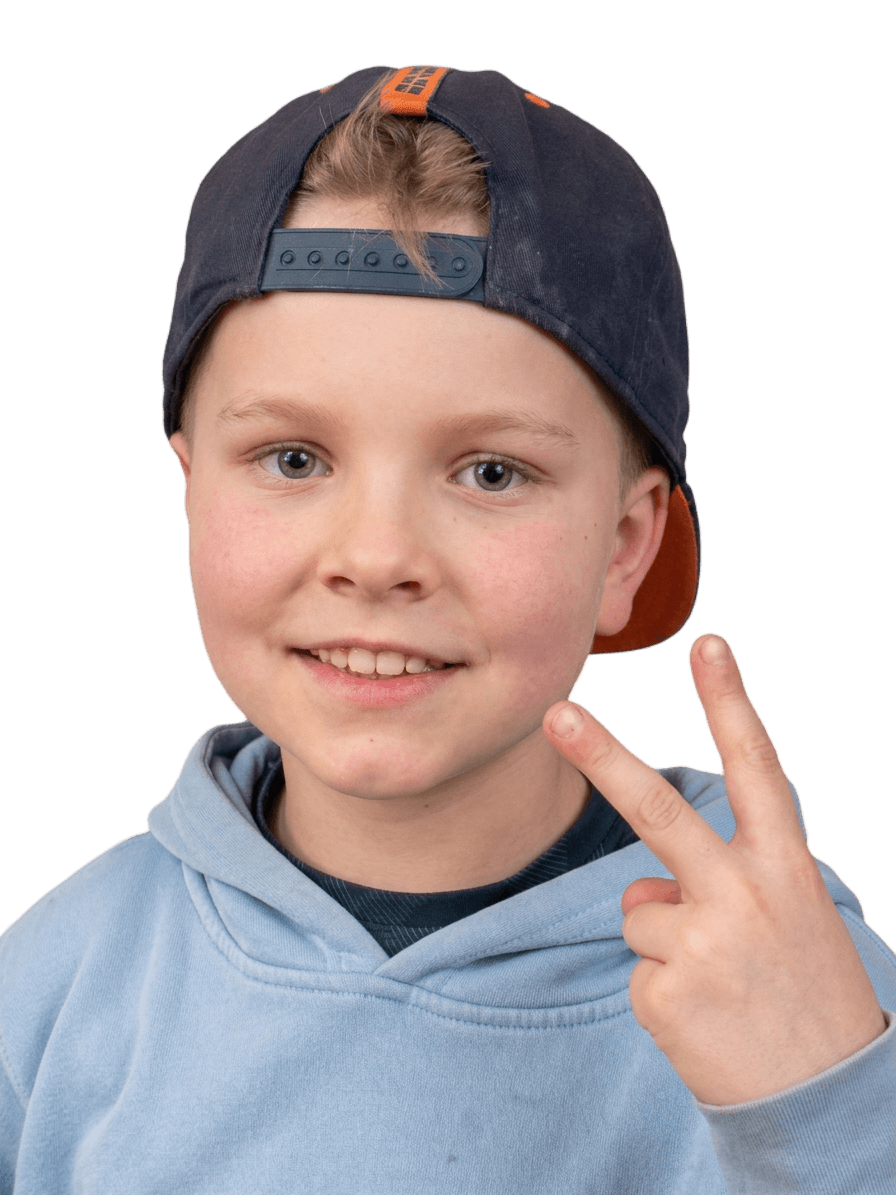 young boy in blue hoodie and cap