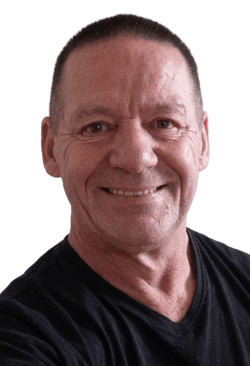 Smiling man in black V-neck shirt